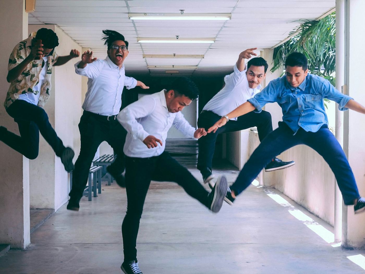 A team jumping together for a photo after an outing