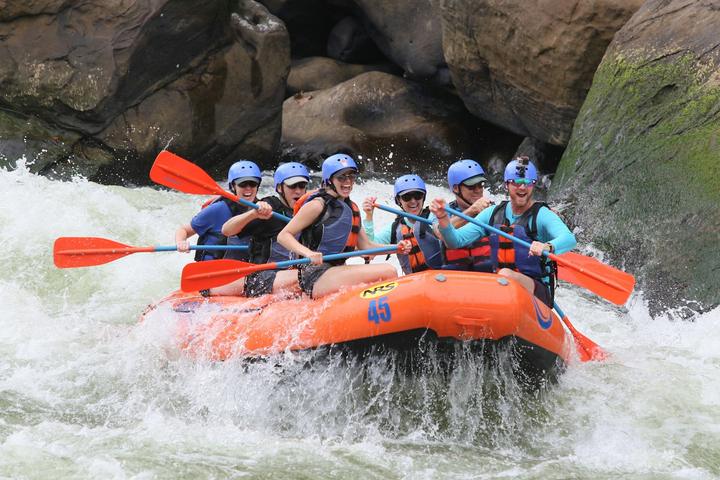 A team rafting through white water